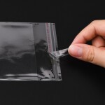 Celofánové sáčky s lepící klopou a otvorem na zavěšení - transparentní - 14 x 8 cm - 100 ks