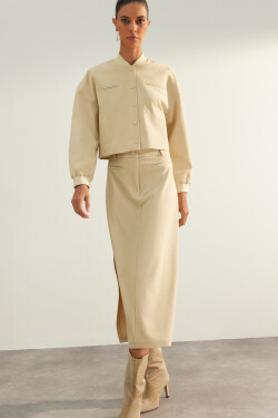 Trendyol béžová limitovaná edice vysoce kvalitní midi sukně z umělé kůže s rozparkem