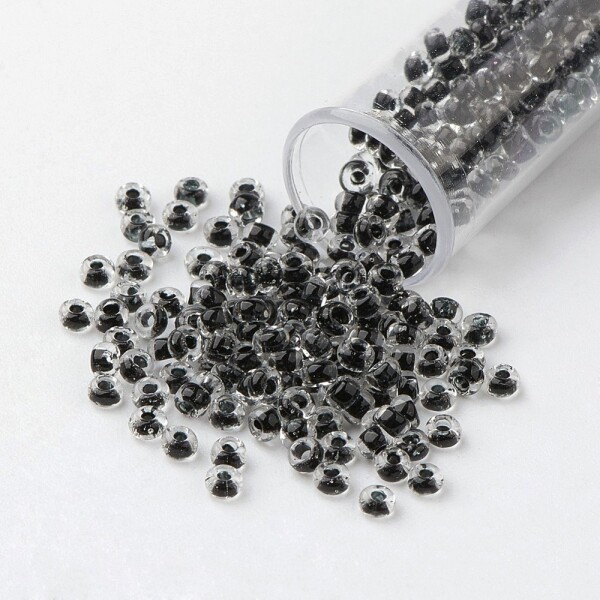 Skleněný rokajl - 6/0 - 4 x 3 mm - průhledný s černým středem - třída A -1 g