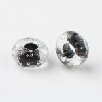 Skleněný rokajl - 6/0 - 4 x 3 mm - průhledný s černým středem - třída A -1 g