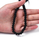 Korálky z polymeru - 7 mm x 5,5 mm - černé - 10ks