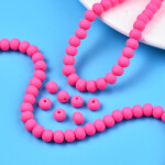 Korálky z polymeru - 7 mm x 5,5 mm - neonově růžové - 10ks