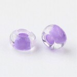 Skleněný rokajl - 11/0 - 2,3 x 1,5 mm - průhledný s fialovým středem - třída A -1 g