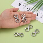 Spojovací mezidíl z nerezové oceli - velký - nekonečno - platinový - 39 x 17 x 3 mm - 1 ks