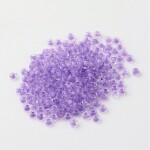 Skleněný rokajl - 11/0 - 2,3 x 1,5 mm - průhledný s fialovým středem - třída A -1 g