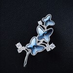 Brož Swarovski Elements Montanari - motýl, Tmavě modrá
