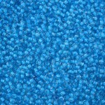 Skleněný rokajl - 11/0 - 2,3 x 1,5 mm - průhledný s tmavě tyrkysovým středem - třída A -1 g