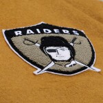 Mitchell & Ness Pánská bunda Oakland Raiders NFL Dusted Varsity Créme Velikost: M